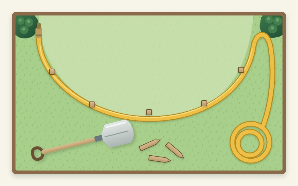 A garden hose laid on a lawn in a smooth curve marking the outline of a new bed, with a few pegs and a spade lying nearby